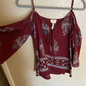 Red blouse with open sleeves